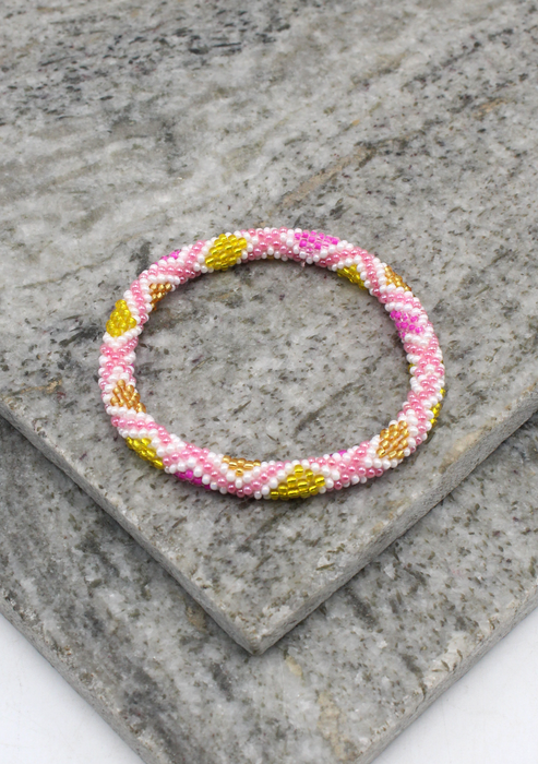Gold Pink Nepalese Roll on Beads Bracelet