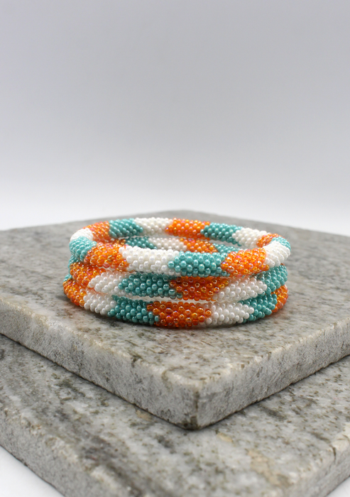 Coral Blue   Orang Stripe   Nepalese Roll on Beads Bracelet