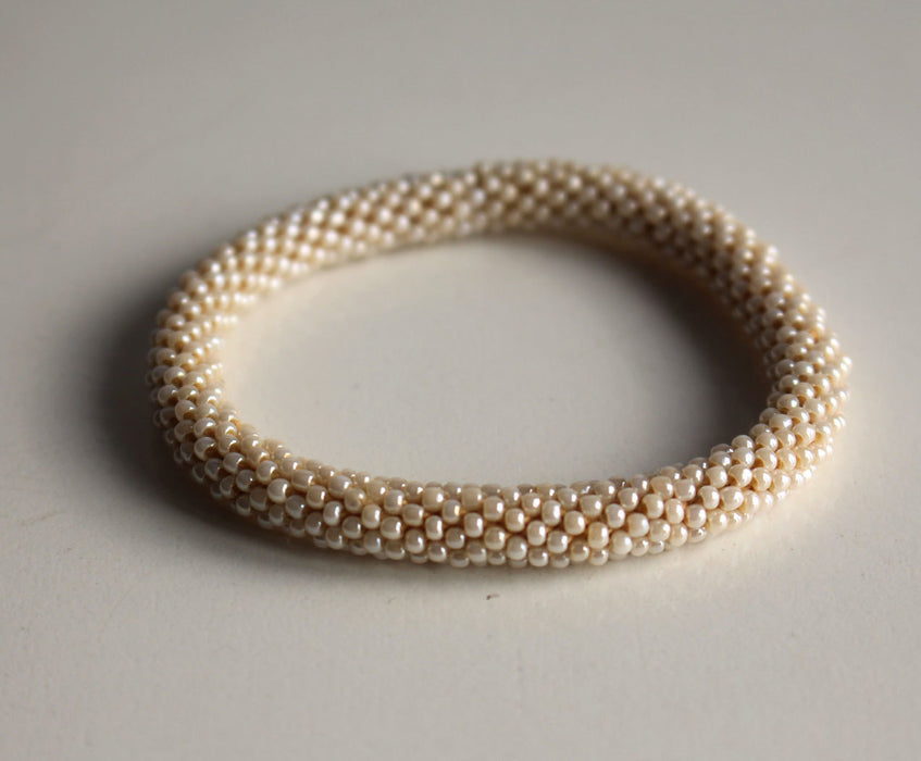 Plain Beige Crocheted Beads Roll On Bracelet