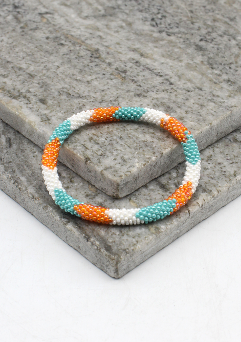 Coral Blue   Orang Stripe   Nepalese Roll on Beads Bracelet