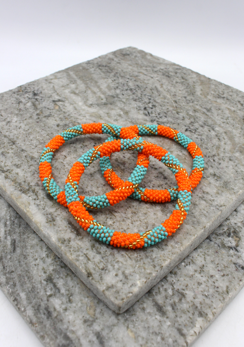 Orange Turquoise   Nepalese Roll on Beads Bracelet