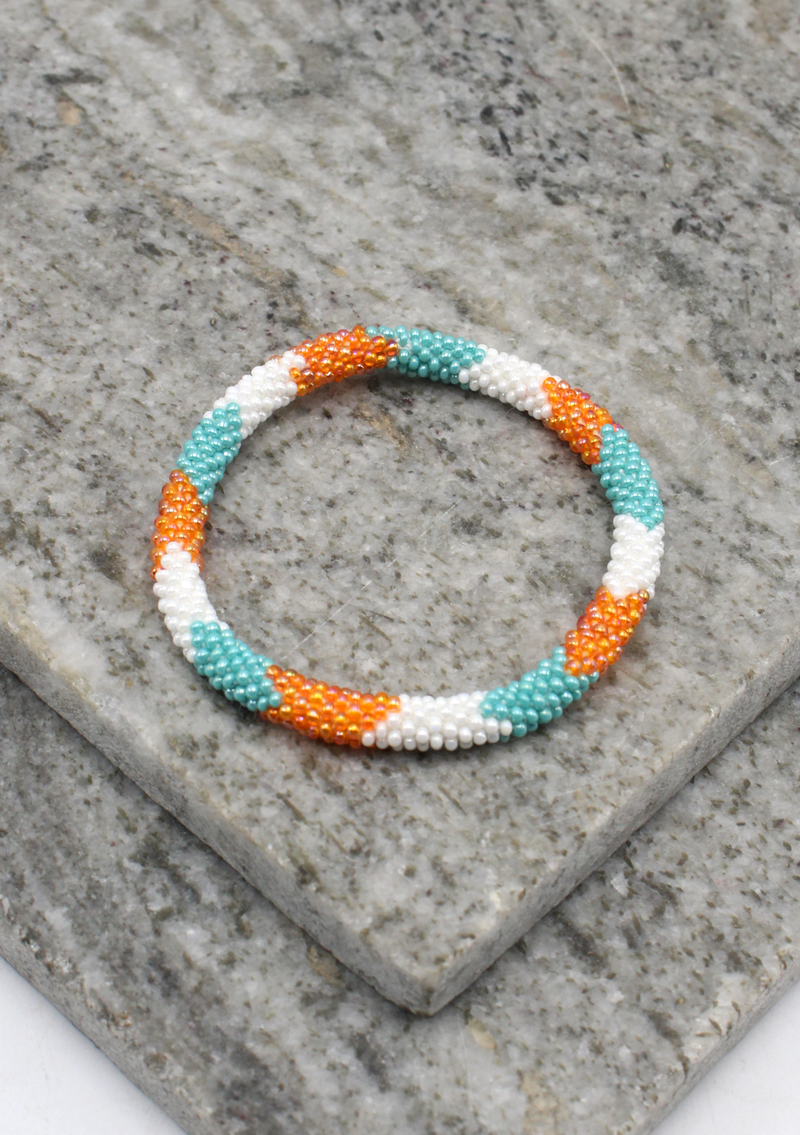 Coral Blue   Orang Stripe   Nepalese Roll on Beads Bracelet
