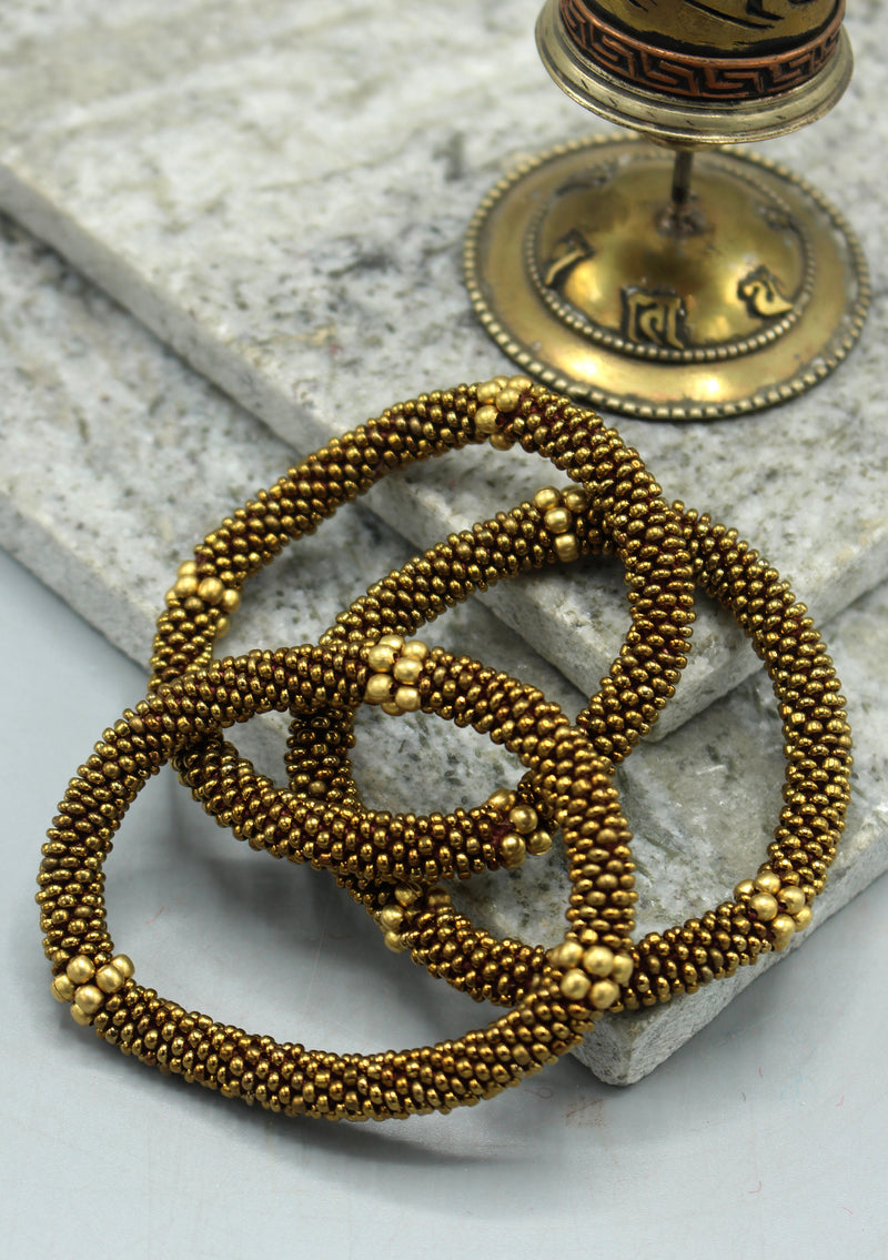 Golden Beads Nepalese Roll on Bracelet