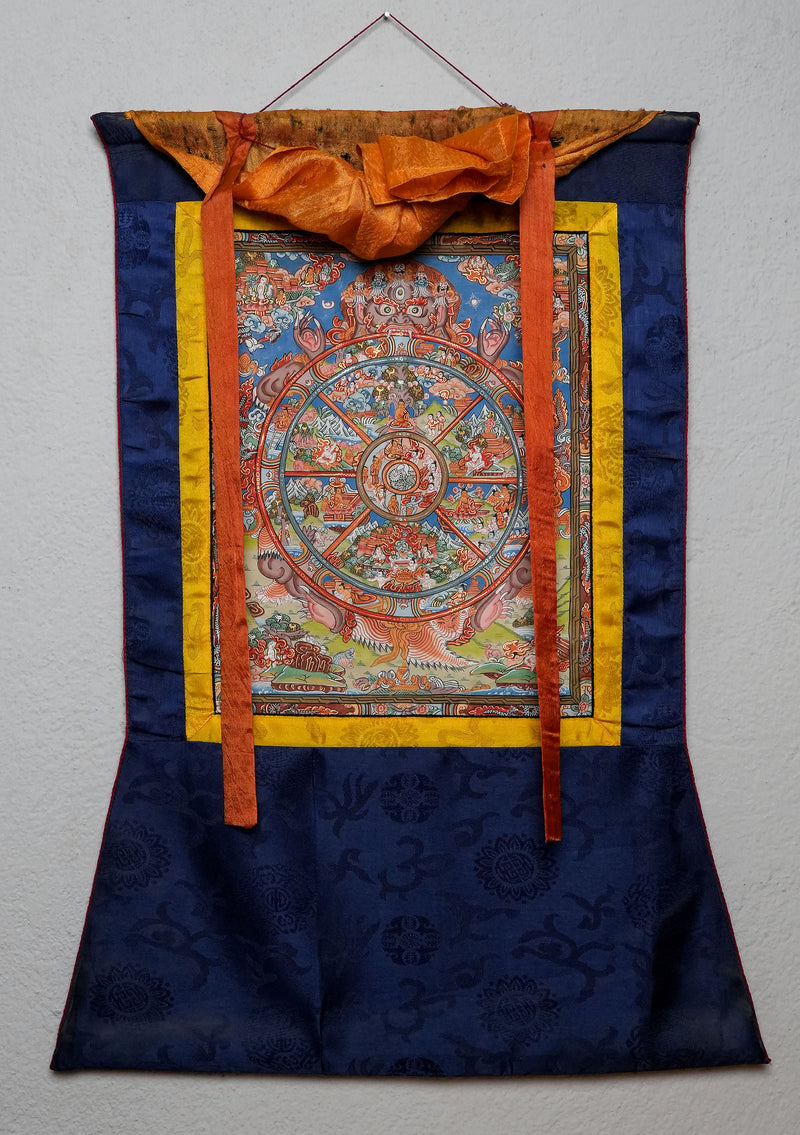 Wheel of Life Thangka Painting with Blue  Brocade