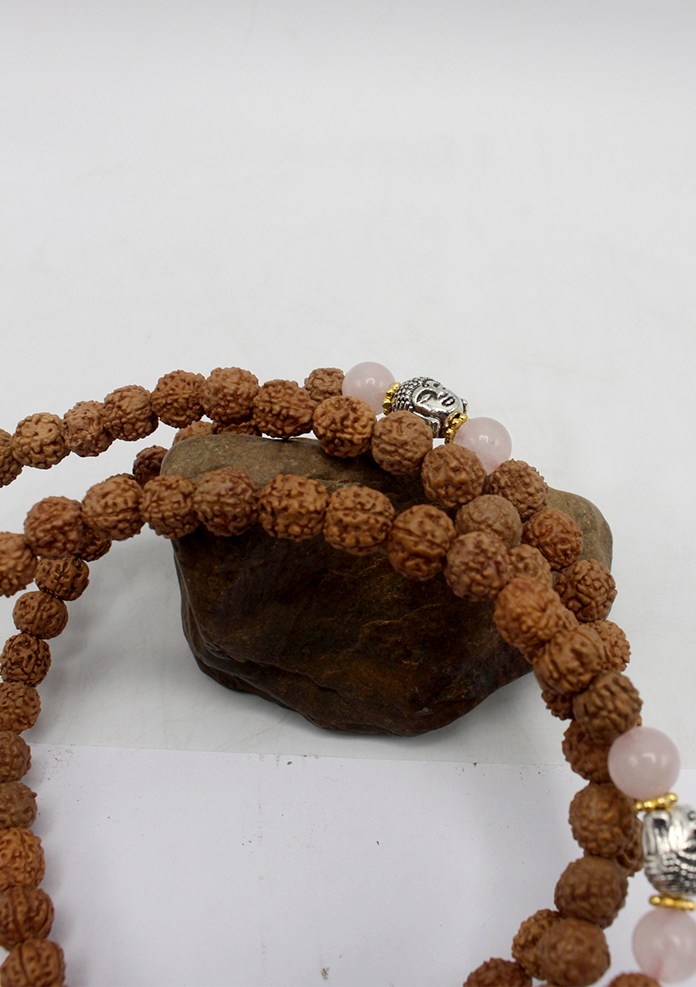 108 Rudraksha Mala with White Metal Buddha Spacer and Red Tassel
