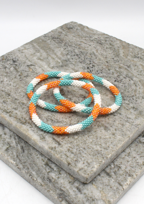 Coral Blue   Orang Stripe   Nepalese Roll on Beads Bracelet