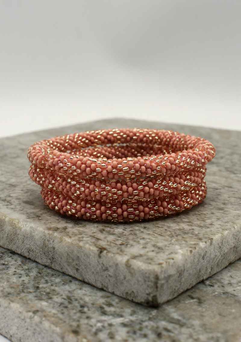 Pink Gold Roll on Beads Nepalese Bracelet