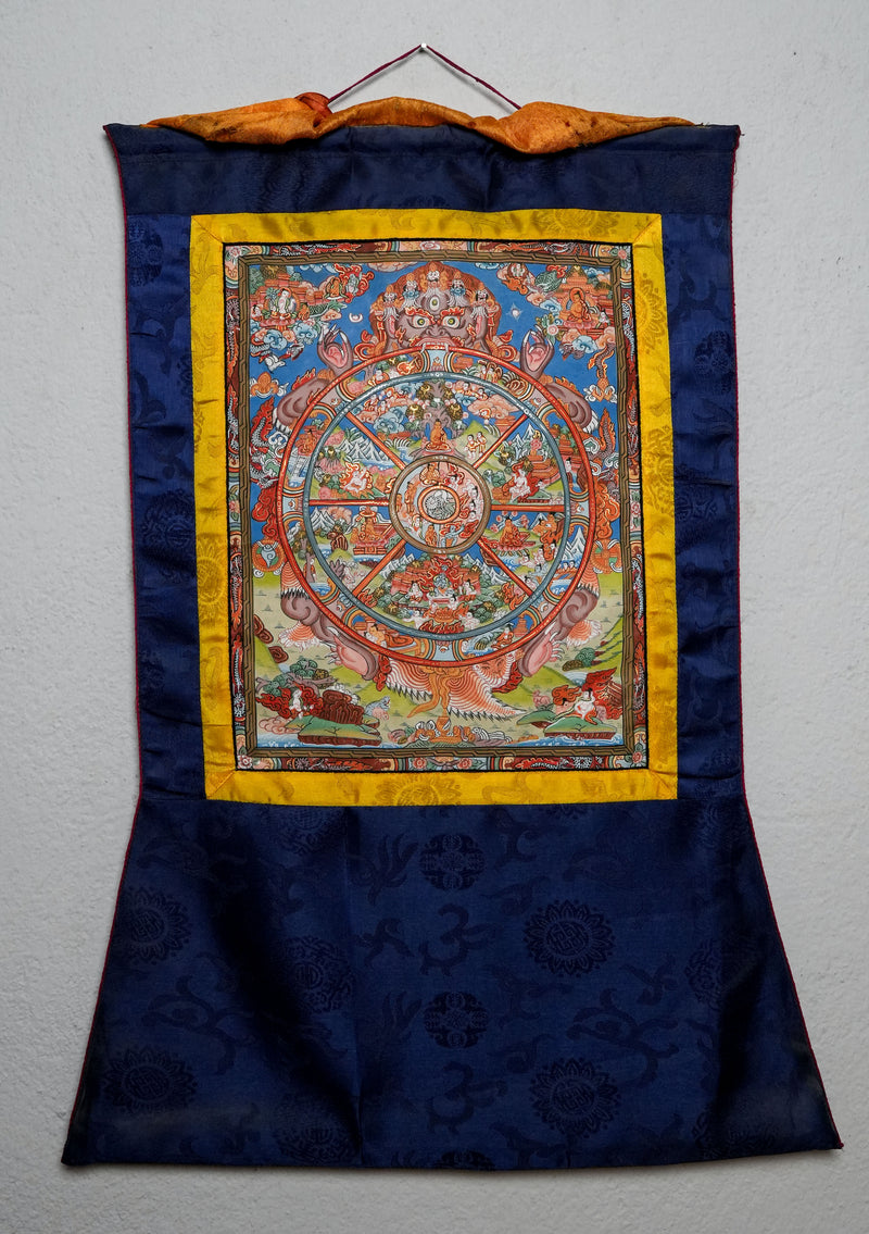 Wheel of Life Thangka Painting with Blue  Brocade