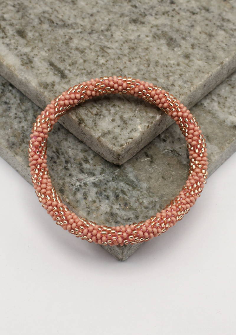 Pink Gold Roll on Beads Nepalese Bracelet