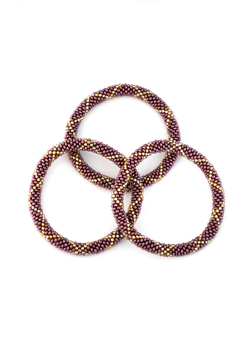 Deep Amethyst with Gold Nepalese Roll Bead Bracelet