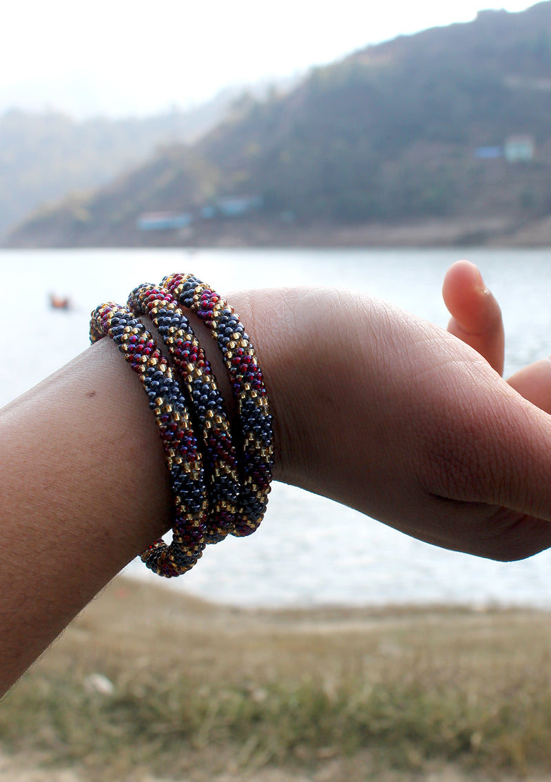 Dark Purple, Gold & Mixed Beads Nepalese Roll on Bracelet