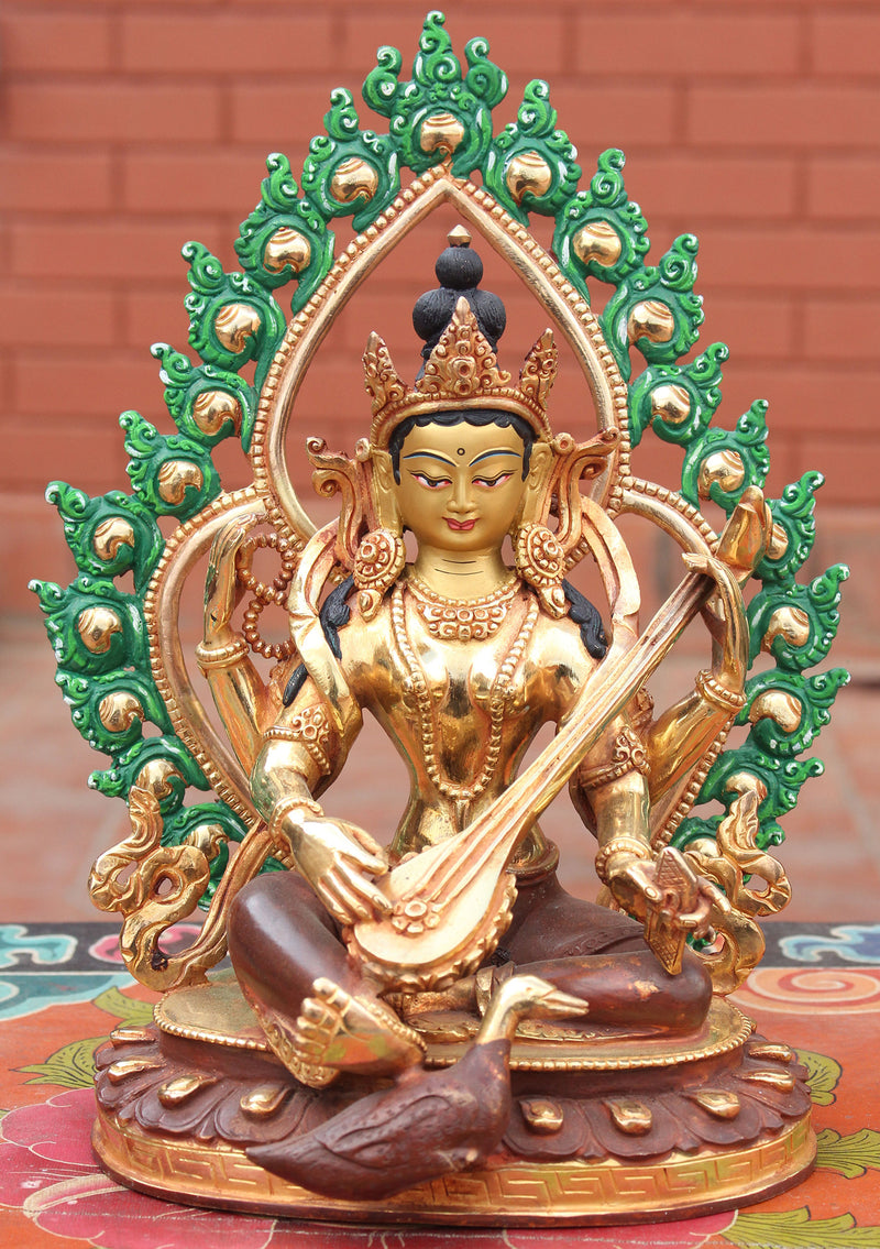 Four Armed Goddess Saraswati Partly Gold Plated Statue with Frame - nepacrafts