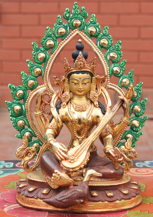 Four Armed Goddess Saraswati Partly Gold Plated Statue with Frame - nepacrafts