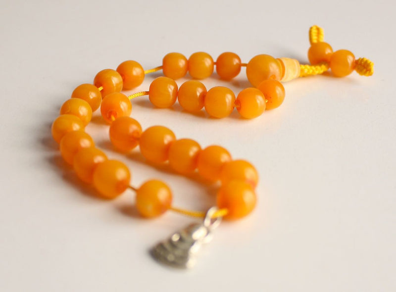 Faux Amber Wrist Mala with Buddha Charm - nepacrafts