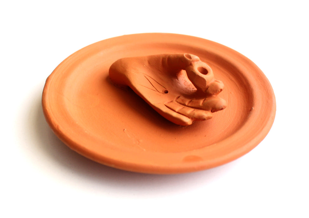 Hand on a Ceramic Base Plate Incense Holder - nepacrafts