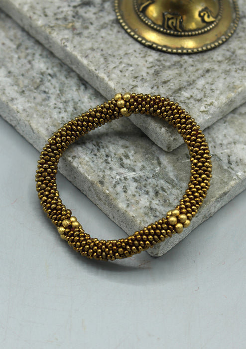 Golden Beads Nepalese Roll on Bracelet