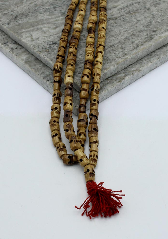 Light Brown Buddhist Skull Prayer Mala With Red Tassle