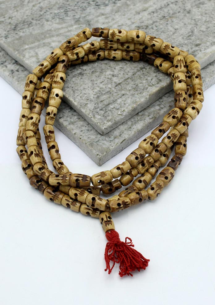 Light Brown Buddhist Skull Prayer Mala With Red Tassle