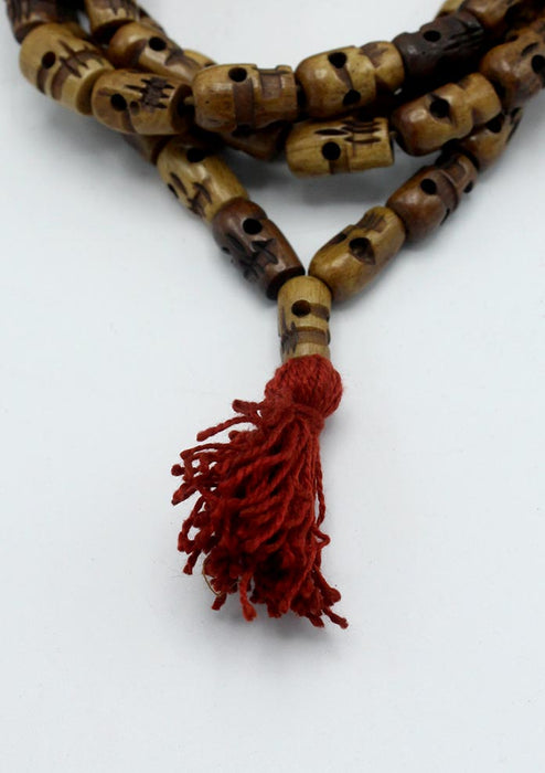 Brown Buddhist Skull Prayer Mala With Red Tassle