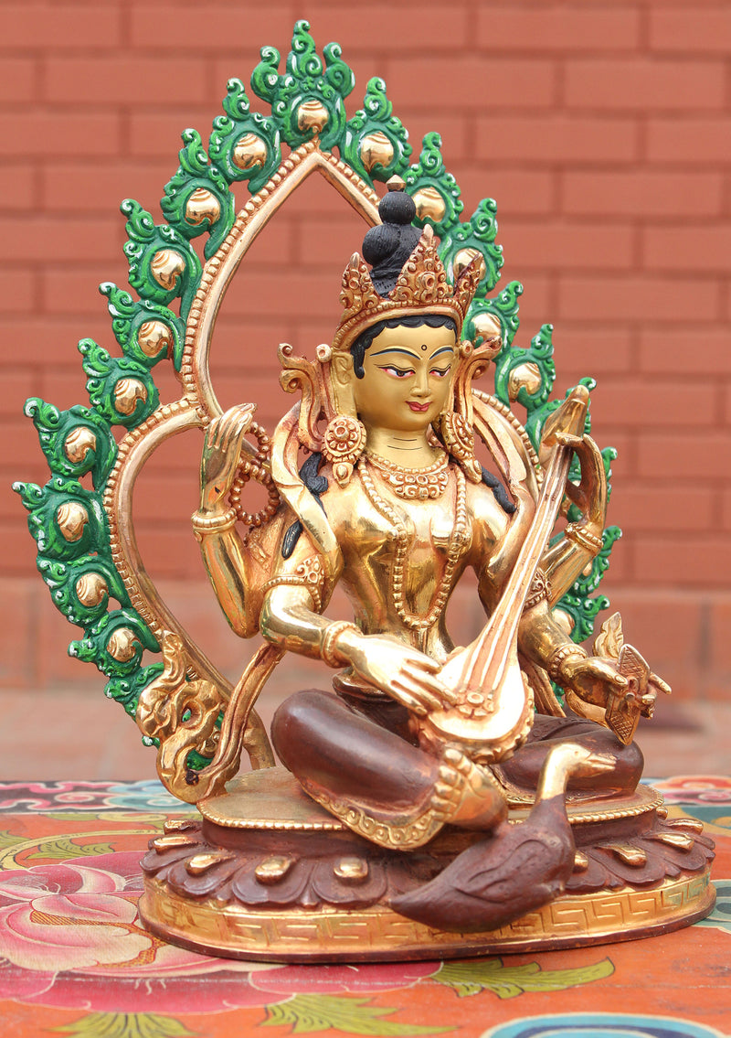 Four Armed Goddess Saraswati Partly Gold Plated Statue with Frame - nepacrafts