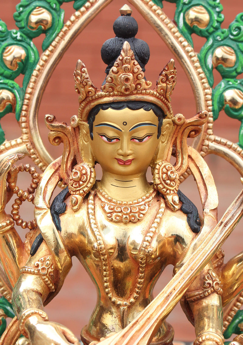 Four Armed Goddess Saraswati Partly Gold Plated Statue with Frame - nepacrafts