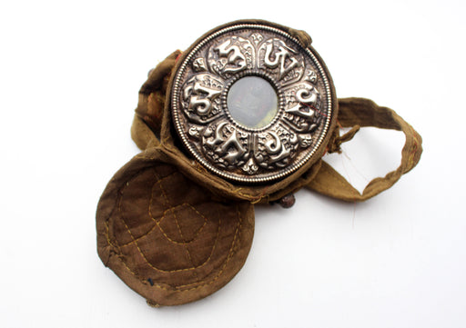 Hand Carved White Metal Amitabh Buddha Ghau Pendant in a Cotton Bag Cover - nepacrafts