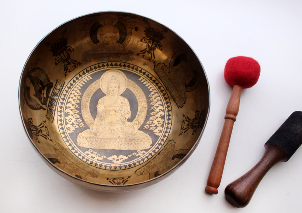 Shakyamuni Buddha and Eight Auspicious Symbol Carved Tibetan Singing Bowl - nepacrafts