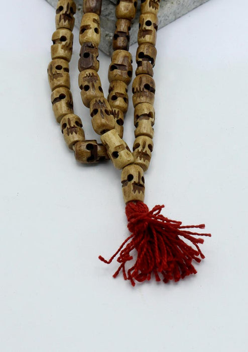 Light Brown Buddhist Skull Prayer Mala With Red Tassle