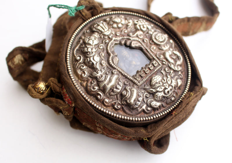 White Metal Auspicious Symbol Carved Chenrezig Ghau Pendant with Cotton Cover - nepacrafts