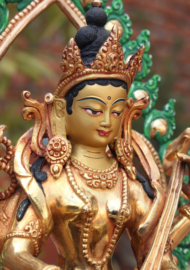 Four Armed Goddess Saraswati Partly Gold Plated Statue with Frame - nepacrafts