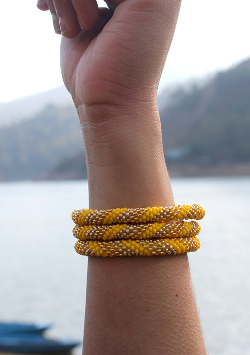 Bright Yellow and Golden Beads Nepalese Roll on Bracelet