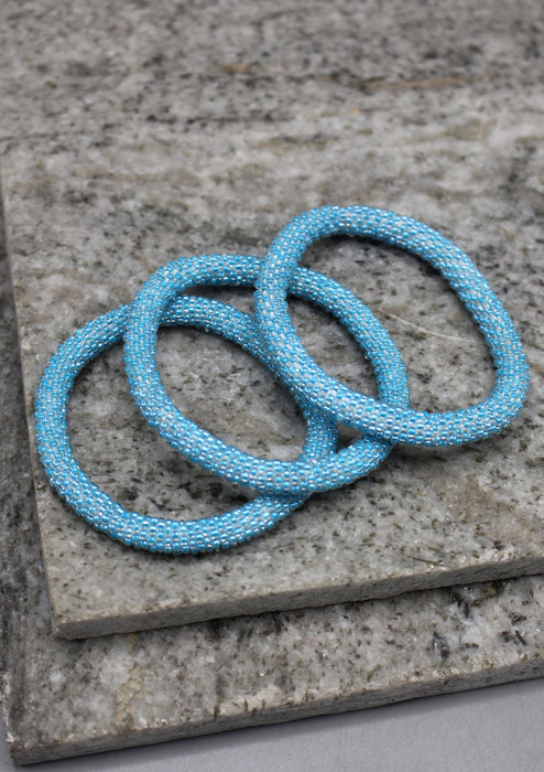 Shiny Light Blue Beads Nepalese Roll on Bracelet