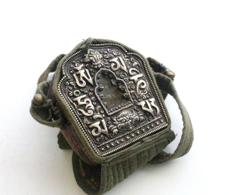 Hand Carved White Metal Manjushri Ghau Pendant - nepacrafts