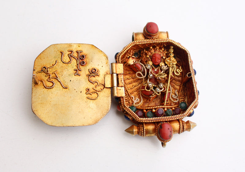 Goldplated Vajrapani Ghau Pendant with Lapis Stone - nepacrafts