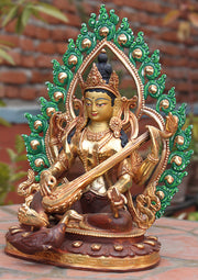 Four Armed Goddess Saraswati Partly Gold Plated Statue with Frame - nepacrafts